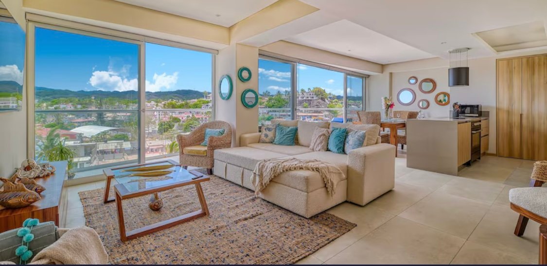 This modern unit features 1 king-size bed, a queen-size bed, and 2 sofa bed, making it perfect for families or small groups. Enjoy a private terrace with ocean views, air conditioning in all rooms, a fully equipped kitchen, and fast Wi-Fi for a comfortable and luxurious stay.